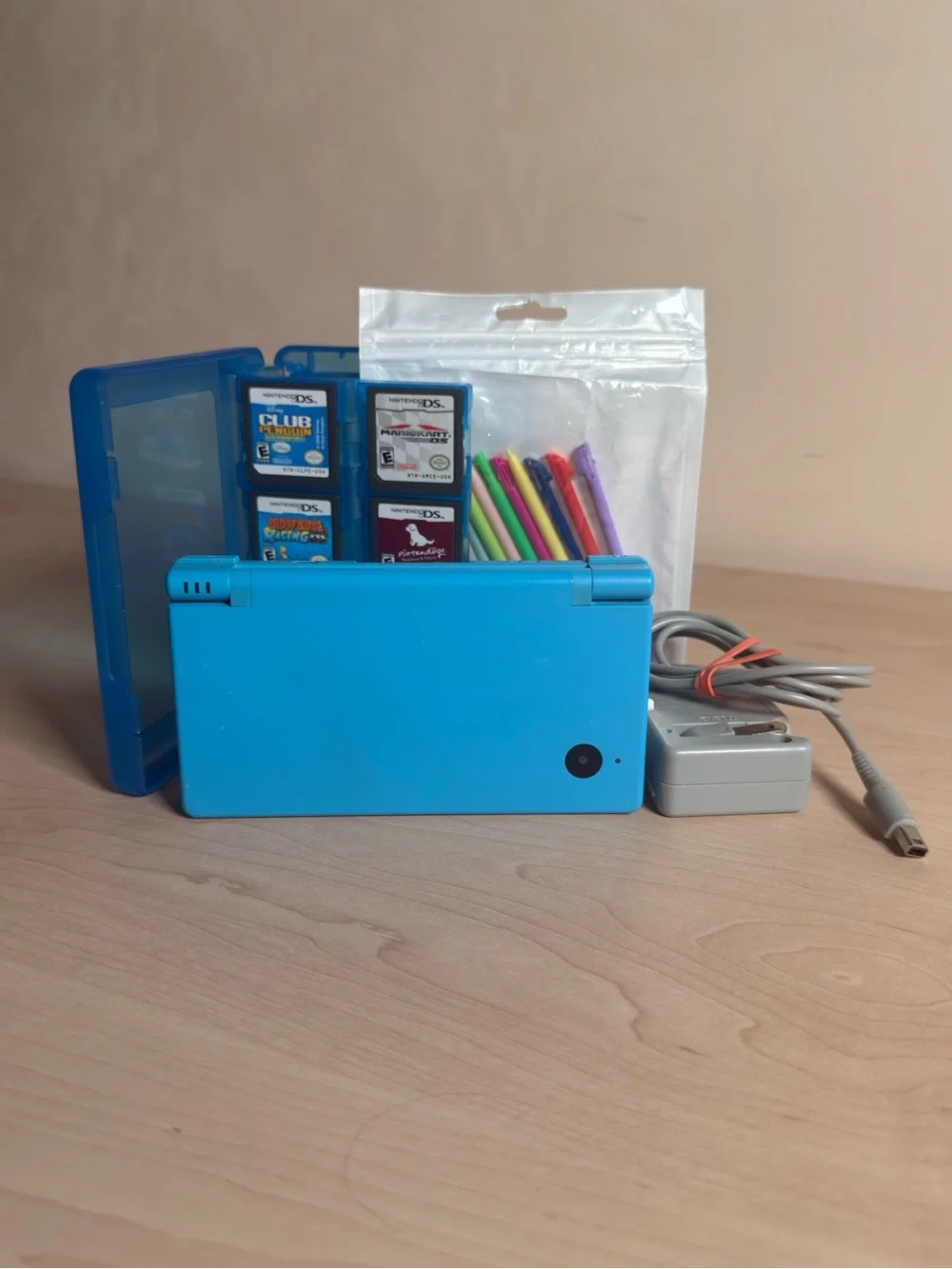 Nintendo DSi Portable Console (Light Blue) w/ games, charger, and stylus pack